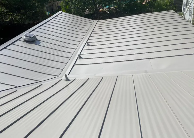 Solar attic fan installed on a metal roof for Roof Ventilation in Orangevale